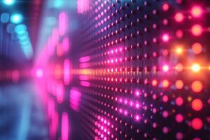 An abstract close-up of illuminated LED lights creating a vibrant pattern in shades of pink, blue, and purple. photo
