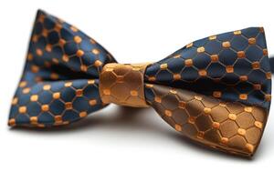 Stylish navy and gold patterned bow tie, perfect for formal occasions or adding a touch of elegance to any outfit. photo