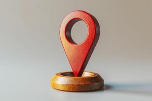 A wooden 3D location pin in red, symbolizing navigation and mapping, set against a neutral background. photo