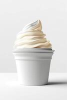 A creamy swirl of soft-serve ice cream in a plain white cup, evoking a sense of indulgence and simplicity. photo