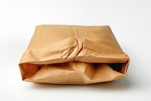 A neatly folded brown paper package, showcasing a minimalist aesthetic on a clean background. photo