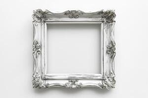 An ornate, vintage-style empty picture frame in white, showcasing intricate designs and giving a classic touch. photo