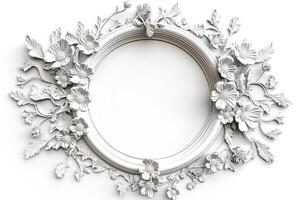 Elegant white decorative frame adorned with intricate floral patterns, perfect for showcasing art or photographs. photo