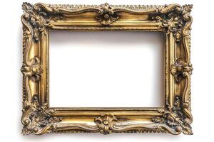 An ornate, vintage-style gold picture frame, intricately designed with floral motifs and curls. photo