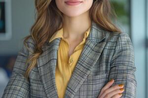 Smiling Caucasian businesswoman in a plaid blazer, exuding confidence and professionalism in a modern office setting. photo