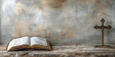 An open Bible lays on a rustic wooden table next to a wooden cross, symbolizing faith and reflection. photo