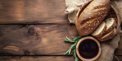 Artisan whole grain bread with a side of red wine, showcasing rustic colors and natural textures, perfect for a cozy gathering. photo