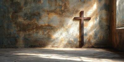 A solitary wooden cross casts a shadow in a dimly lit, rustic room with weathered walls, conveying a sense of quiet reflection. photo