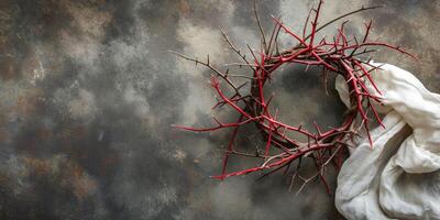 An artistic arrangement featuring a crown of red thorns atop a textured background with soft fabric, evoking a sense of tradition. photo