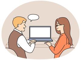 Smiling colleagues work on laptop in office vector