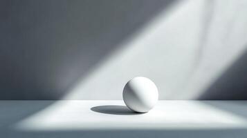 Minimalist still life with a white sphere, shadows, and a clean aesthetic, evoking a sense of tranquility and simplicity. photo