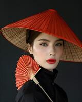 Lady in red hat with matching fan, showcasing a stylish fashion accessory photo