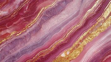 Abstract pink and gold layers create luxurious, swirling patterns, reminiscent of polished stone or watercolor marbling. photo