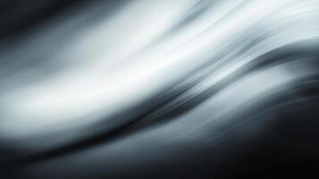 A smooth, flowing abstract design of monochrome blending together to create a modern and stylish background texture. photo