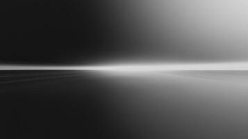 A black and white minimalist landscape with a strong horizon line. Soft gradients create depth in the otherwise abstract composition. photo