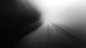 Abstract black and white image with radial blur, simulating a light source emerging from darkness, capturing a sense of speed and contrast. photo