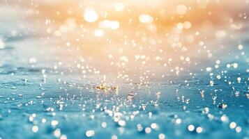 Raindrops falling onto a flat surface, creating splashes and ripples with a bright, blurred background in orange and yellow tones. photo