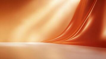 Abstract scene featuring a luxurious, flowing orange fabric gracefully draped against a light, gradient background and a shiny surface. photo