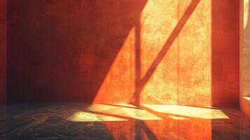 Sunlight streams into a room with orange walls, casting shadows. The light accentuates the wall's texture and creates an inviting glow. photo