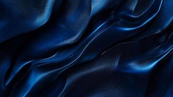 Abstract deep blue, luxurious fabric with delicate, shimmering folds and glossy texture catches light, emphasizing its elegant, silky drape. photo