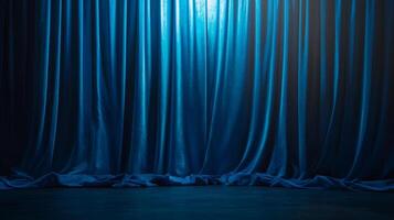 A dramatic, captivating background featuring luxurious, flowing blue curtains, evoking theatrical performance or sophisticated elegance. photo