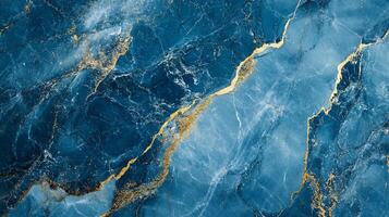 Blue and gold marble with swirling texture, creating a luxury and sophisticated effect. High-resolution texture for graphic design use. photo