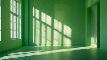 A vibrant green room bathed in sunlight, creating a play of light and shadow. The windows cast geometric patterns on the walls and floor. photo