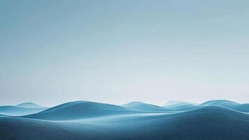 Abstract blue waves under a hazy sky, evoking a sense of tranquility and vastness. A minimalist landscape with soft, dreamlike qualities. photo