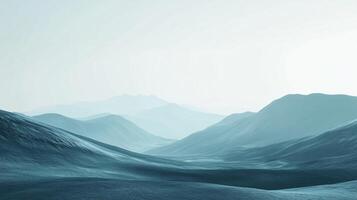Misty mountains and valleys recede into the horizon in serene landscape. Overlapping peaks in shades of blue create tranquil atmosphere. photo