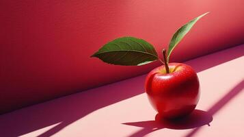 Vibrant, enticing shot of a red apple illuminated by sharp shadows, set against a matching colored background. A study in minimalism. photo