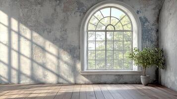 Sunlight streams through an arched window, illuminating a plant and textured wall in a serene room. The space exudes a sense of peace. photo