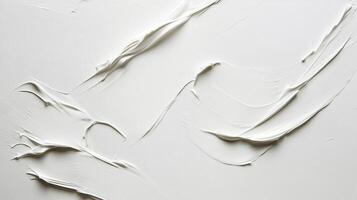 Abstract textured background of white paint or cream. Thick, glossy strokes create a flowing, organic pattern over a clean, bright surface. photo