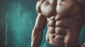 Close-up shot of a well-defined muscular torso. The abs are prominently displayed, indicating rigorous training and dedication to fitness. photo