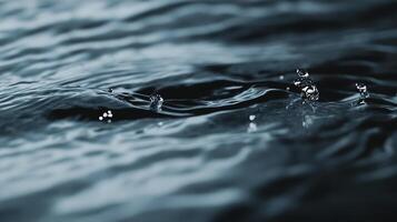 Water droplets dance on the surface, creating a mesmerizing display of motion and reflection in a tranquil aquatic environment. photo