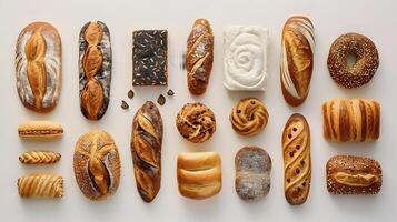 Assorted breads and pastries displayed on a white surface photo