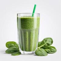 A glass of spinach smoothie with fresh green leaves isolated on a white background. Healthy drink. Close-up image of food, macro. Design and advertising element, banner photo