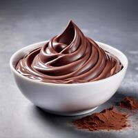 Chocolate cream, soft paste in a bowl. Dark chocolate, cocoa. Close-up food image, front view. Design element photo
