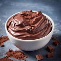 Chocolate cream, soft paste in a bowl. Dark chocolate, cocoa. Close-up food image. Design element photo