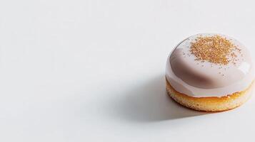 A small pastry with a white frosting on top photo
