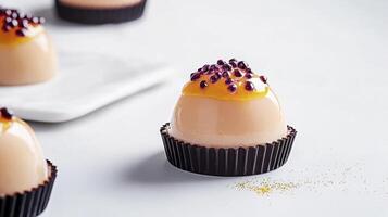 Three chocolate eggs with a gold and purple decoration photo