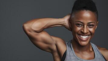 A woman with her arms up smiling photo