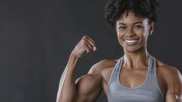 A woman with a muscular body showing off her muscles photo