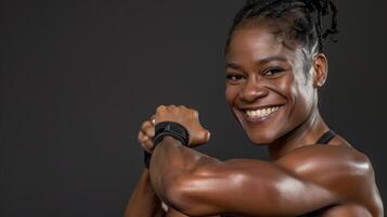 A woman with a muscular arm smiling photo