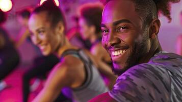 A man smiles while doing a zumba class photo