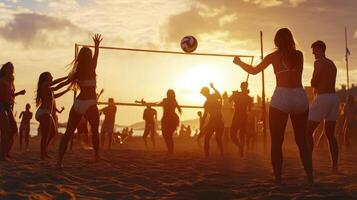 A group of people playing volleyball on the beach at sunset photo