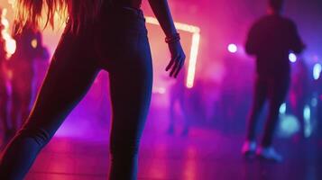 A woman in a tight pants standing in front of a crowd photo
