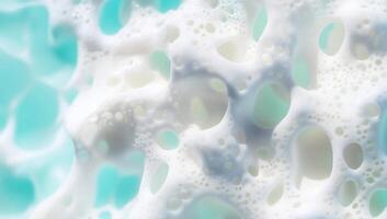 Abstract foam texture with bubbles in a turquoise background. photo