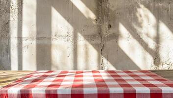 Table cloth on a wooden table with a red and white checkered tablecloth photo