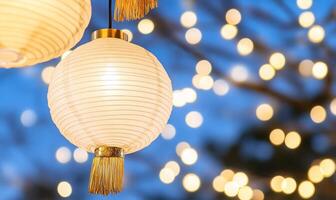 Illuminated paper lanterns against a blurred bokeh background. photo