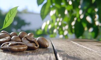 Coffee beans on a wooden surface with green leaves in the background. photo